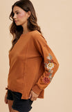 Floral Embroidered Sleeve Mineral Wash Knit Top